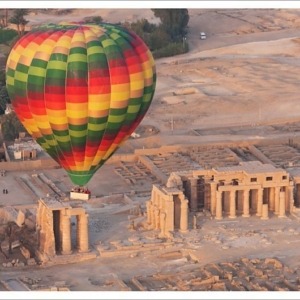 A hot air balloon flight over a ruined temple near Luxor, Thebes, Egypt, North Africa, Africa