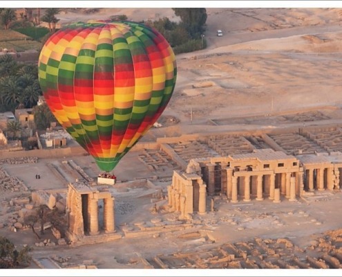A hot air balloon flight over a ruined temple near Luxor, Thebes, Egypt, North Africa, Africa